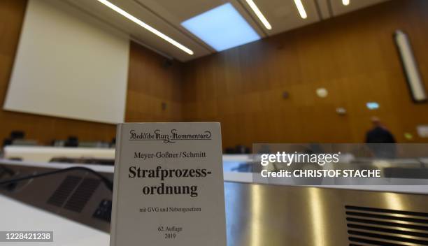 Book of Criminal Procedure Code stands on September 9, 2020 at the indictment table of the courtroom of the district court of Munich, southern...