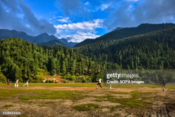 Kashmiri boys play cricket in Gagangir, about 80kms from Srinagar, the summer capital of Jammu and Kashmir.