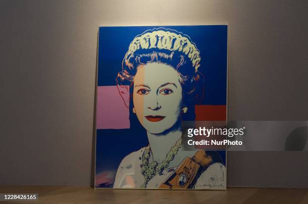 Editorial use only) 'Queen Elizabeth II' from: Reigning Queens screenprint in colours with diamond dust by Andy Warhol is displayed during a press...