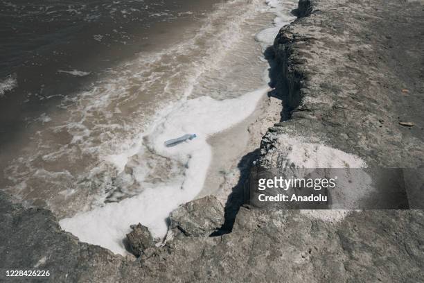 Plastic water bottle dragged to the coast by waves at the Lake of Urmia in the northwest of Iran, which had been shrinking in one of the worst...