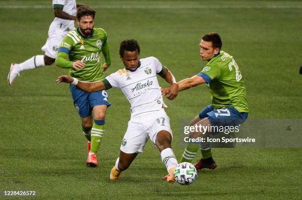 Seattle Sounders defender Shane O'Neill defends against Portland Timbers forward Jeremy Ebobisse during a MLS match between the Seattle Sounders and...