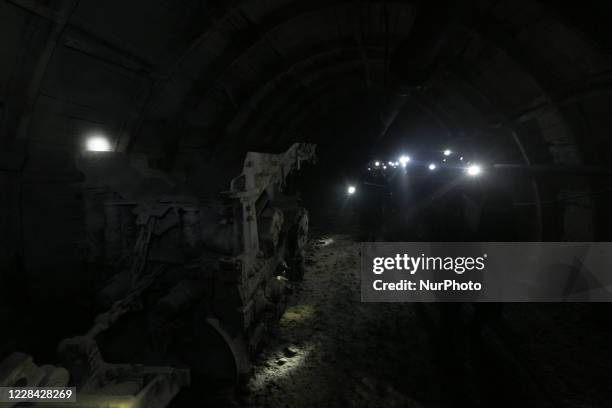 The miners walks past an old mining machinery at the prospecting drift of the bottom level of the mine in Toretsk, Ukraine, August 30, 2020. 400...