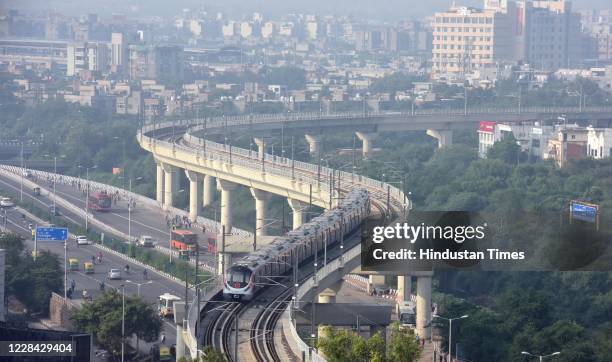 An aerial view of metro trains in operation, seen from Anand Vihar, on September 9, 2020 in New Delhi, India. DMRCs Blue and Pink line metro services...