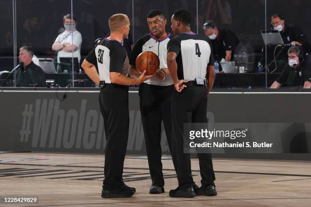 Orlando, FL NBA Referees John Goble, Tony Brothers, and Sean Wright officiate a game between the Boston Celtics and the Toronto Raptors during Game...