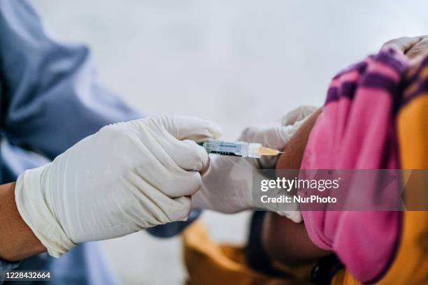 School in Jimbaran, Bali, Indonesia, with the local health centre, facilitates the students with Measles-Rubella and Cervical Cancer immunization, on...