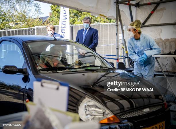 Netherland's King Willem-Alexander looks on as he visits a coronavirus testing site in Leiderdorp, The Netherlands on September 10, 2020. - In the...