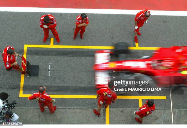 German F1 driver Michael Schumacher stops his Ferrari 23 October, 2004 at the pits of the Interlagos racetrack in Sao Paulo, Brazil. Brazil's F1 GP...