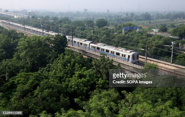Delhi Metro is seen taking passengers on Blue line between Dwarka Sec -21 to Electronic City/Vaishali as Delhi Metro Rail corporation resumes its...