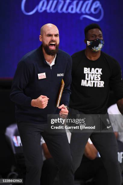 Assistant Coach Ben Sullivan of the Milwaukee Bucks reacts to a play during the game against the Miami Heat during Game Two of the Eastern Conference...