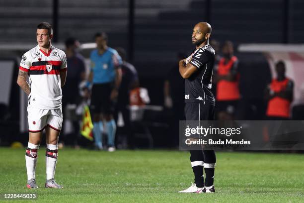 Renato Kayzer of Atletico GO and Fellipe Bastos of Vasco protest against violence in the training of the Figueirense team and violence against women...