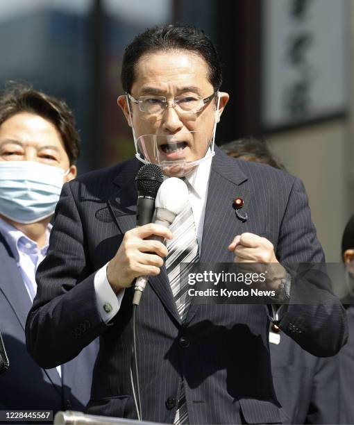 Fumio Kishida, policy chief of Japan's Liberal Democratic Party, makes a stump speech in Tokyo on Sept. 11 ahead of the ruling party's presidential...