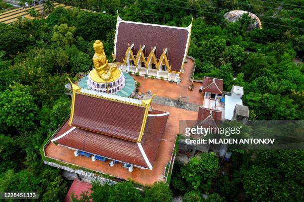 An aerial view shows the giant Buddha statue at the Buddhist temple Wat Samphran in Nakhon Pathom, some 40km west of Bangkok, on September 11, 2020....