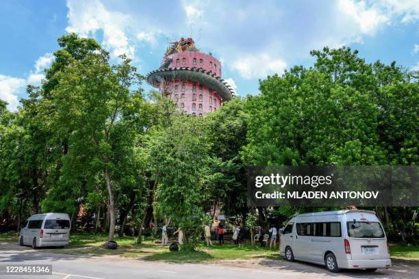 Visitors arrive at the Buddhist temple Wat Samphran in Nakhon Pathom, some 40km west of Bangkok, on September 11, 2020. - Wat Samphran is a popular...