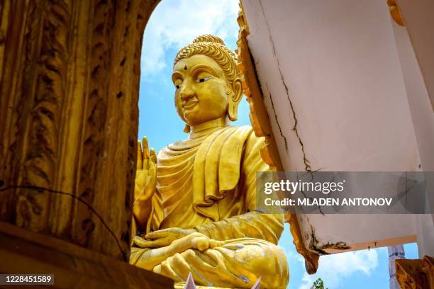 Giant Buddha statue is pictured at the Buddhist temple Wat Samphran in Nakhon Pathom, some 40km west of Bangkok, on September 11, 2020. - Wat...