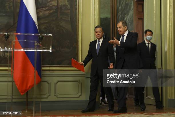 Russian Foreign Minister Sergey Lavrov and Chinese Foreign Minister Wang Yi arrive to hold a joint press conference after their meeting in Moscow,...