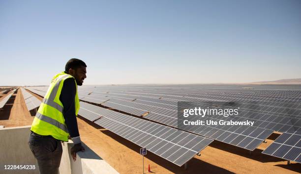 Employees of the Benban Solar Park is watching the panels on February 07, 2020 in Benban, Egypt.