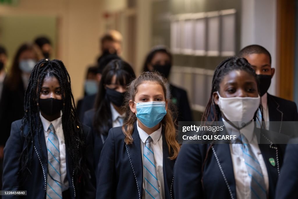 Year eight pupils wear face masks as a precaution against the... News