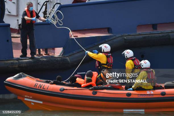 Migrants picked up at sea whilst crossing the English Channel are brought into the Marina in Dover, southeast England on September 11, 2020 on an...