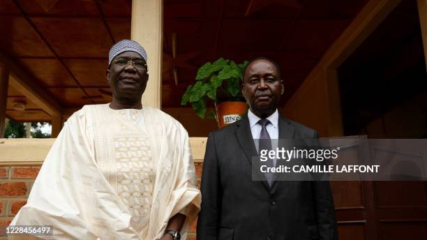 Former Central African Republic heads of state Fran?ois Bozize and Michel Djotodia stand next to each other at a meeting in Bangui on September 11...