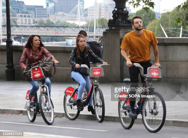 People seen riding santander hire bikes along the embankment in Westminster.