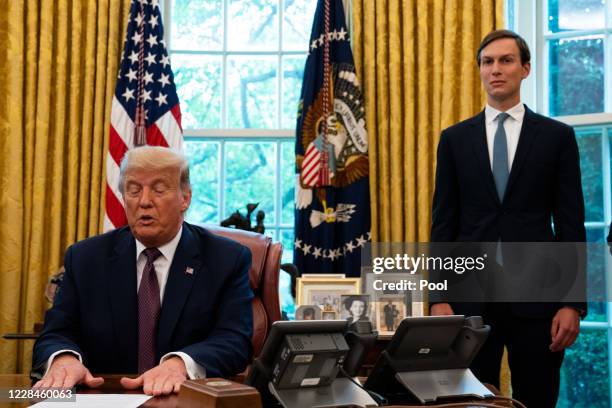 Advisor Jared Kushner looks on as U.S. President Donald Trump speaks in the Oval Office to announce that Bahrain will establish diplomatic relations...