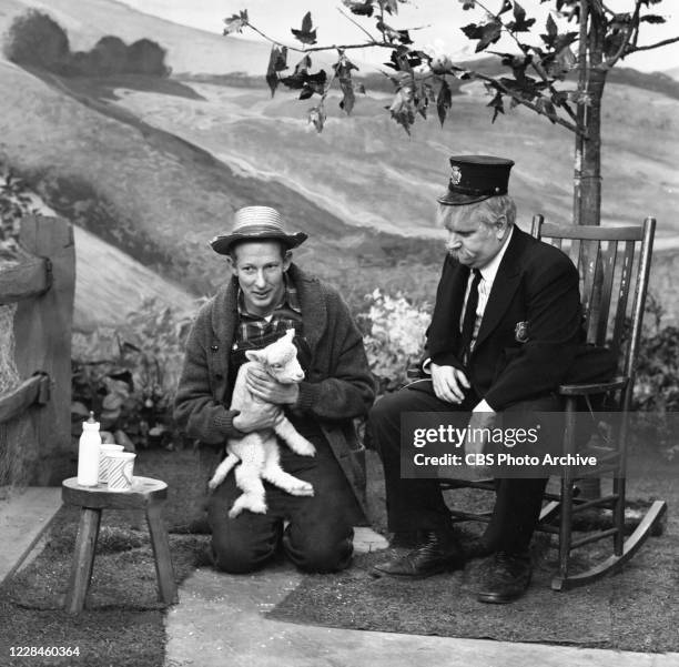 Pictured from left is Hugh Brannum as Mr. Green Jeans and Robert 'Bob' Keeshan with animals. Image dated December 22, 1955.