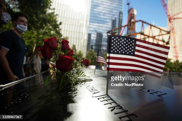 People visit the National September 11 Memorial and Museum prior to the night tribute on September 11, 2020 in New York City. The the evening tribute...