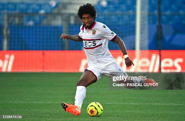 Nice's Brazilian defender Dante passes the ball during the French L1 football match between Montpellier and Nice at the Mosson Stadium in...
