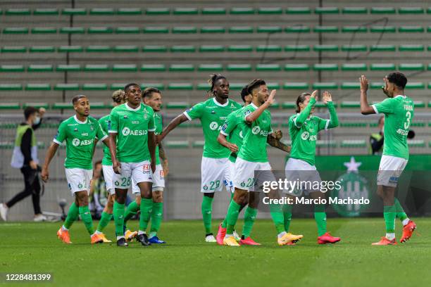 Mahdi Camara of Saint-Étienne celebrates with his teammates after scoring his goal during the Ligue 1 match between Saint Etienne v Strasbourg at...