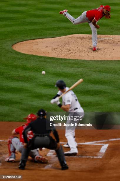 Starting pitcher Jaime Barria of the Los Angeles Angels delivers to home plate against Ryan McMahon of the Colorado Rockies on his way to striking...