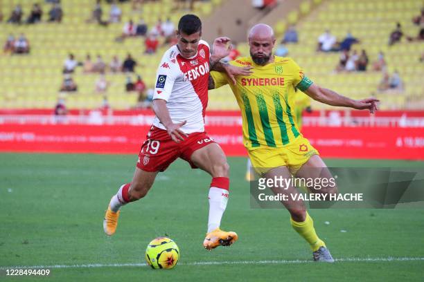 Monaco's Italian forward Pietro Pellegri vies for the ball with Nantes' French defender Nicolas Pallois during the French L1 football match between...