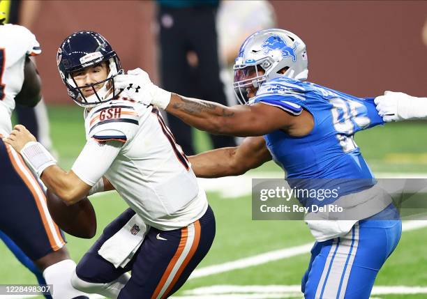 Romeo Okwara of the Detroit Lions grabs the facemask of Mitchell Trubisky of the Chicago Bears in the fourth quarter at Ford Field on September 13,...