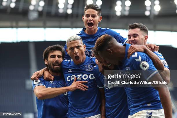 Dominic Calvert-Lewin of Everton celebrates with teammates Andre Gomes , Richarlison , James Rodriguez , Michael Keane and Yerry Mina of Everton...