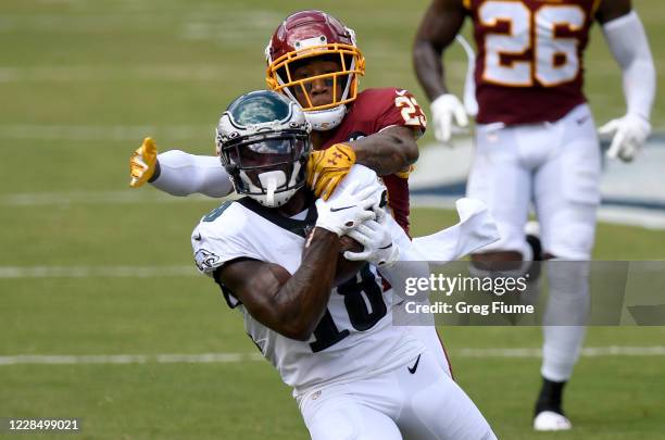 Jalen Reagor of the Philadelphia Eagles makes a catch against Ronald Darby of the Washington Football Team in the first quarter at FedExField on...