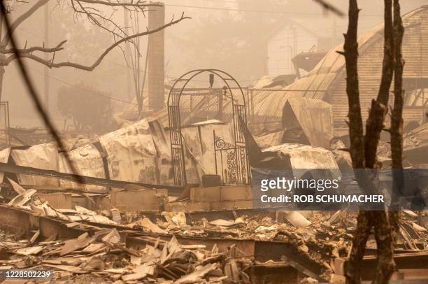 The remnants of several homes are seen destroyed by the Beachie Creek Fire in Gates, east of Salem, Oregon on September 13, 2020. - The wildfire...