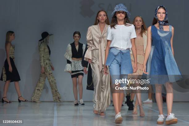 Models showcase creations during 'The No Waste Show' - a show of ecological fashion created from recycling materials by first and second year...
