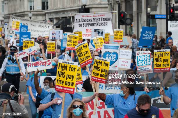 Staff march from BBC Broadcasting House to Trafalgar Square through central London in a protest to demand 15% pay rise for NHS workers on 12...