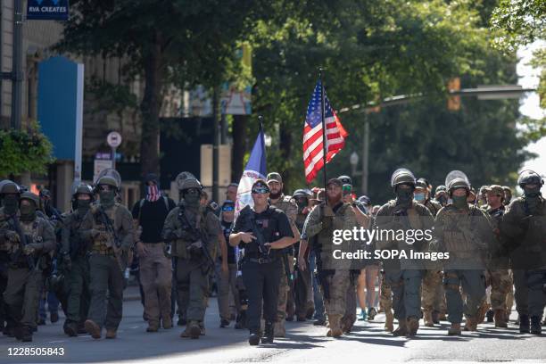 Armed gun rights protesters march down Broad Street. Protesters led by Boogaloo Boy Mike Dunn, protested against new firearm restrictions that were...