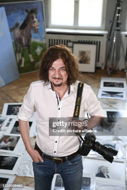 September 2020, Berlin: The Berlin photographer Andre Kowalski at a photo session. His pictures will be shown in the exhibition AENO Painting and...