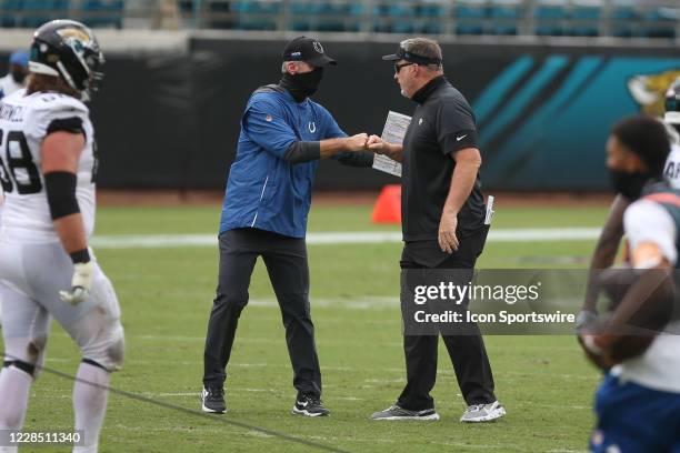 Indianapolis Colts Head Coach Frank Reich and Jacksonville Jaguars Head Coach Doug Marrone greet following the game between the Indianapolis Colts...