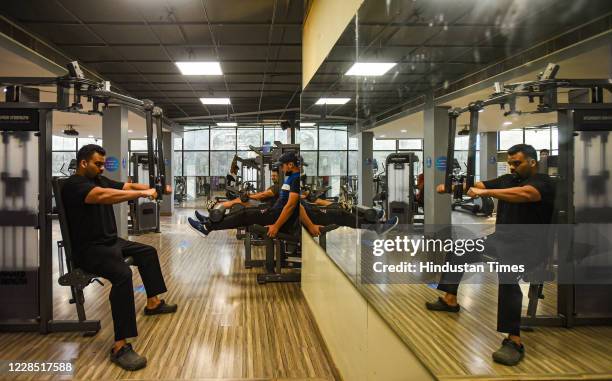 Fitness enthusiasts work out inside Anytime Fitness gym after it reopened for the first time since the nationwide lockdown was imposed to curb the...