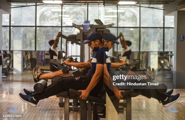 Fitness enthusiasts work out inside Anytime Fitness gym after it reopened for the first time since the nationwide lockdown was imposed to curb the...