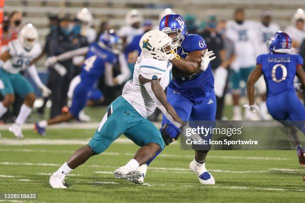 Coastal Carolina Chanticleers defensive end Tarron Jackson tries to get past Kansas Jayhawks offensive lineman Malik Clark in the fourth quarter of a...