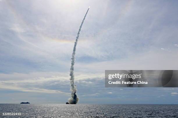 The CZ-11 rocket, carrying nine satellites, rises from a ship in the Yellow Sea in east China's Shandong province Tuesday, Sept. 15, 2020. It is...