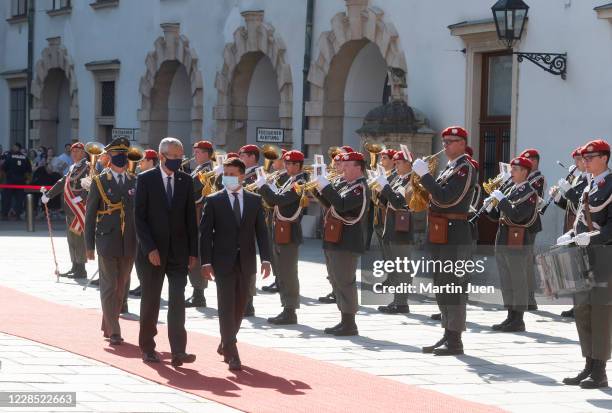 Federal President Alexander van der Bellen and President of Ukraine Volodymyr Selensky arrive for a reception with military honors during the...