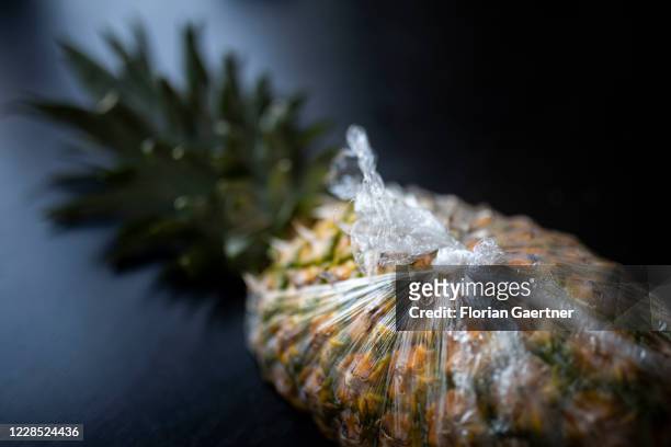 An ananas packed in plastic is pictured on September 15, 2020 in Berlin, Germany.