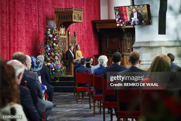 King Willem-Alexander addresses from the throne to members of the Senate and House of Representatives as Queen Maxima listens on Budget Day in the...