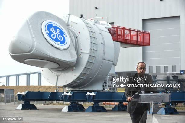 Senior vice president of General Electric and CEO of General Electric Renewable Energy Jerome Pecresse delivers a speech in front of the first of the...