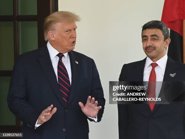 President Donald Trump welcomes the arrival of UAE Foreign Minister Abdullah bin Zayed Al-Nahyan on the North Lawn of the White House in Washington,...