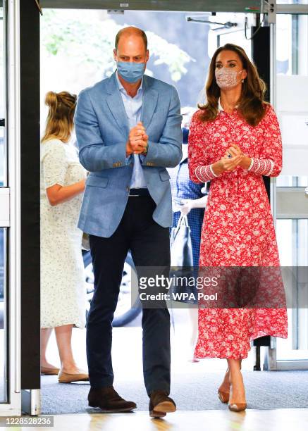 Prince William, Duke of Cambridge and Catherine, Duchess of Cambridge use hand sanitizer as they arrive at the London Bridge Jobcentre on September...